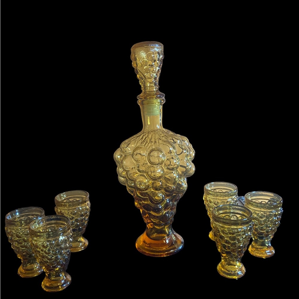 Vintage amber glass decanter and cup set UV reactive grape motif